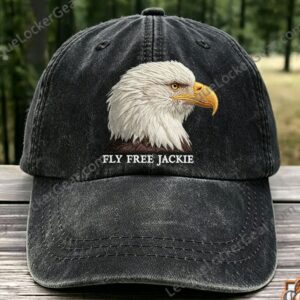 Bald Eagle Fly Free Jackie Hat - close-up of the cap's crown and blurred forest background