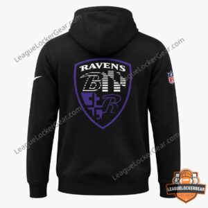 Baltimore Ravens Engineered for Ravens Hoodie - model wearing black hoodie and white cap on field
