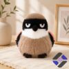 Grumpy Face Shrike Bird Plush Toy - full front view on a textured mat