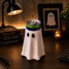 Ghost Spooky Halloween Can Cooler Beverage Holder 2026 - front view on a desk with books