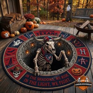 Houston Texans Halloween Quilted Round Rug - full view on a wooden deck