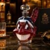 Lets Go Tribe 125th Anniversary Chief Wahoo Whiskey Decanter 2026 - front view on a dark marble surface