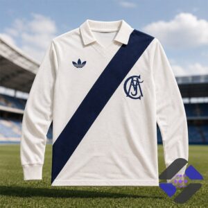 Retro Adidas style long sleeve polo shirt with diagonal stripe on a sports field