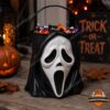 Scream Ghostface Halloween 2026 Trick or Treat Candy Bucket - full view, filled with wrapped candy