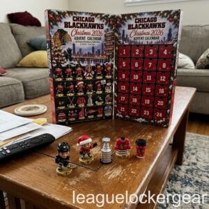 Chicago Blackhawks Christmas 2026 Advent Calendar - both panels on a coffee table with five Hawks designs