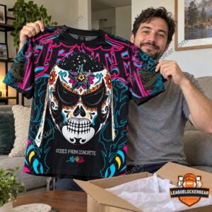 Man holding up the Penta T-shirt after unboxing