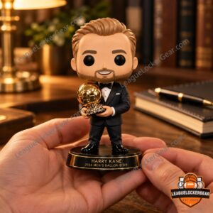 Hand holding the Harry Kane Ballon d'Or figure