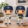 Jake Bauers figures in home white and navy alternate Brewers uniforms with the NLCS MVP trophy