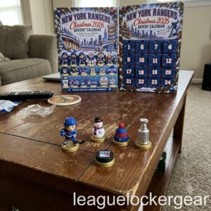 New York Rangers Christmas 2026 Advent Calendar - both panels on a coffee table with five designs