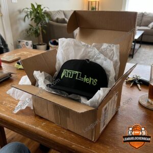 ATLiens snapback in an open shipping box